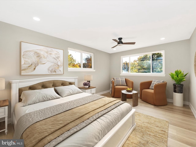 bedroom with ceiling fan and light wood-type flooring