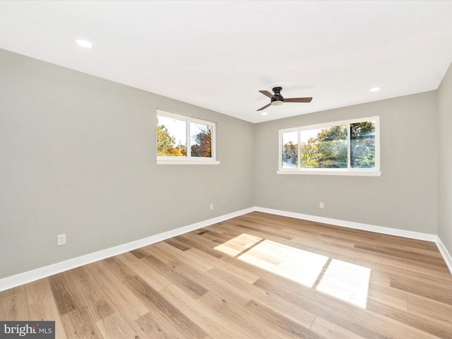 unfurnished room featuring ceiling fan and light hardwood / wood-style flooring