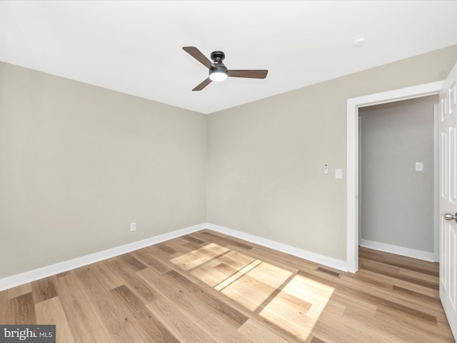 unfurnished room with light wood-type flooring and ceiling fan