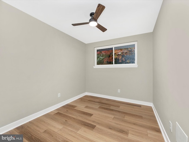 spare room featuring ceiling fan and light hardwood / wood-style floors