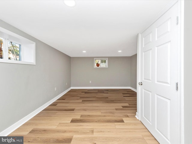 basement featuring light hardwood / wood-style flooring