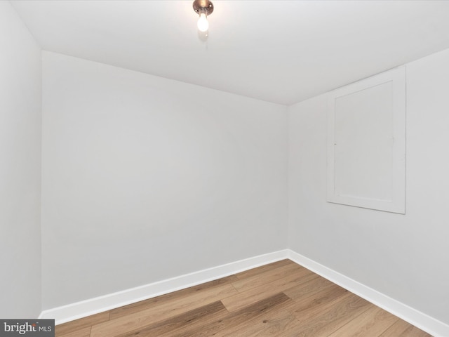 unfurnished room with hardwood / wood-style floors