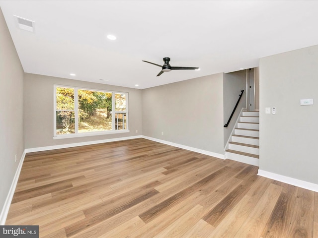 unfurnished living room featuring light hardwood / wood-style floors and ceiling fan