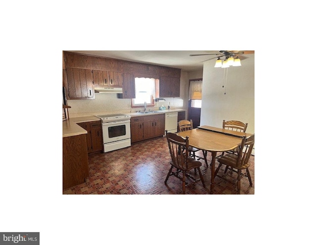 kitchen featuring sink, white appliances, and ceiling fan