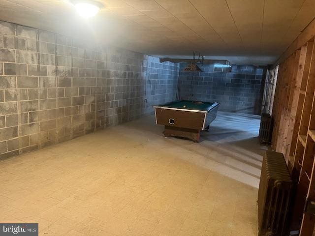 basement with radiator heating unit