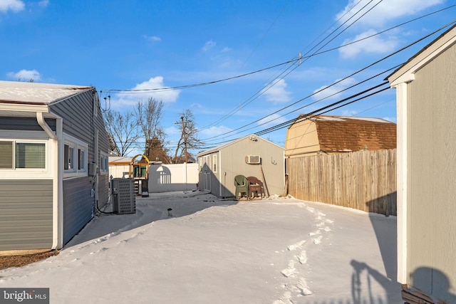 view of yard featuring central air condition unit and a playground