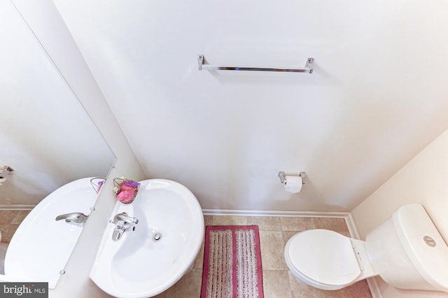 bathroom with toilet and sink