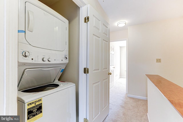 washroom featuring stacked washing maching and dryer and light colored carpet