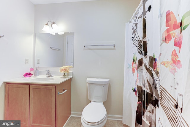 bathroom with toilet, vanity, tile patterned floors, and walk in shower