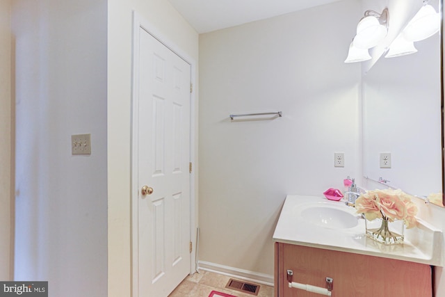 bathroom with vanity and tile patterned flooring