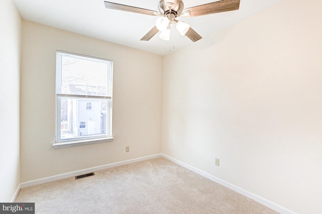 carpeted empty room with ceiling fan