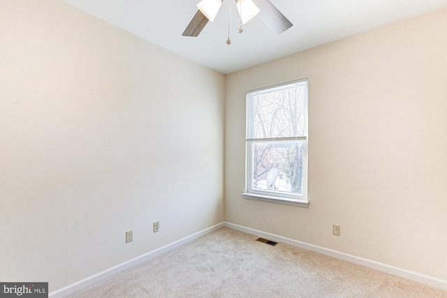 empty room with light carpet and ceiling fan