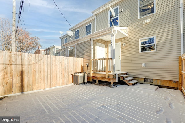 rear view of house with central AC