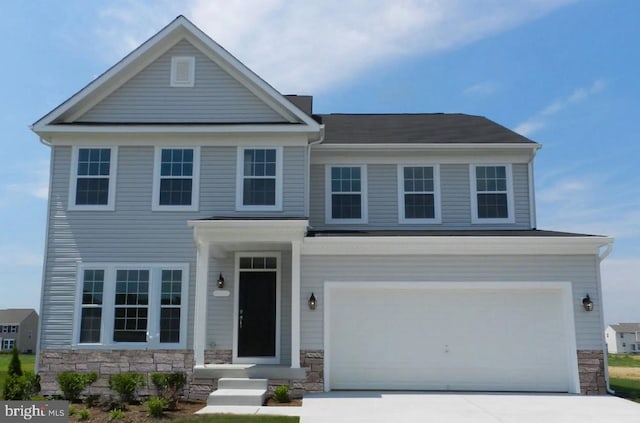 view of front of property with a garage