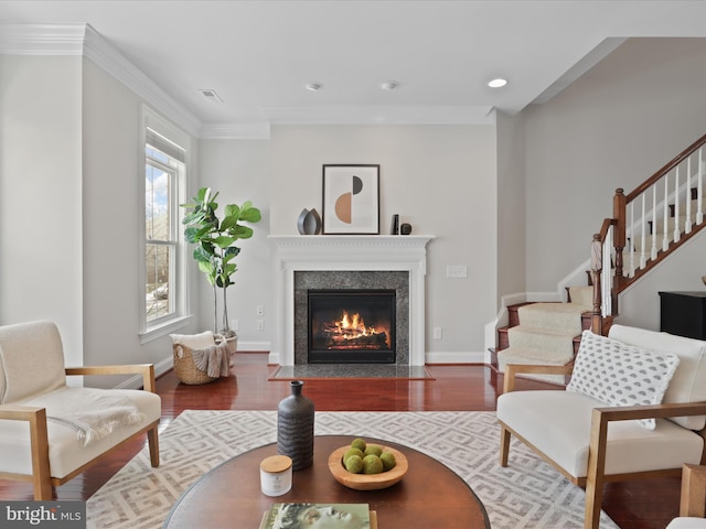 living room featuring dark hardwood / wood-style flooring and crown molding