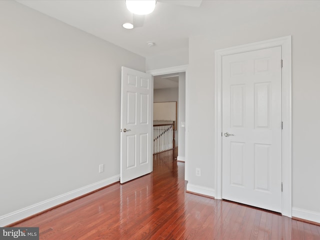 unfurnished bedroom with hardwood / wood-style flooring and ceiling fan