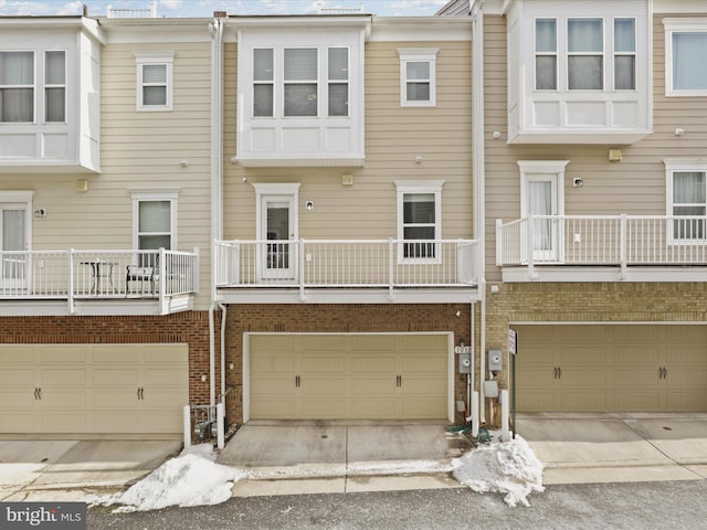 rear view of property featuring a garage