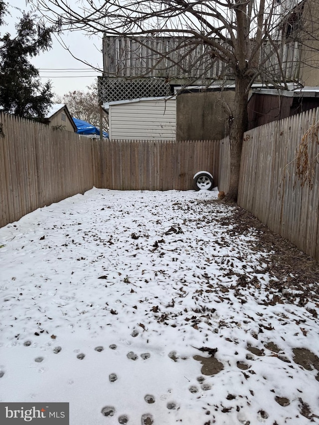 view of yard covered in snow