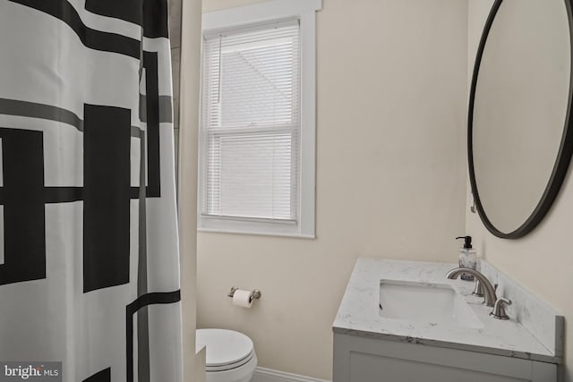 bathroom with vanity and toilet