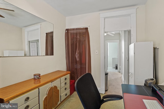 office space with ceiling fan and light colored carpet