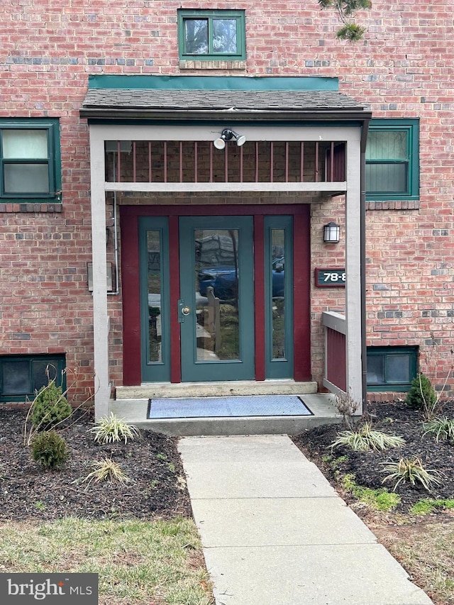 property entrance with brick siding