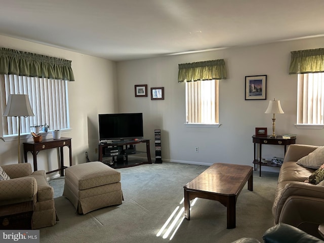 carpeted living room featuring plenty of natural light