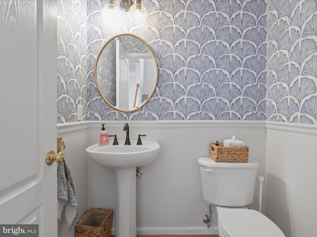 bathroom featuring sink and toilet