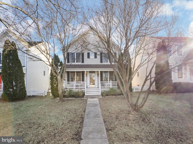 view of front facade with a porch and a front lawn