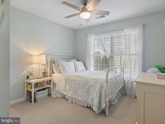 carpeted bedroom with ceiling fan