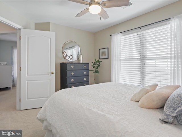 carpeted bedroom featuring ceiling fan