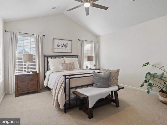 bedroom featuring multiple windows, lofted ceiling, light carpet, and ceiling fan