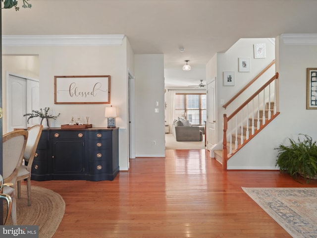 entryway featuring ornamental molding and wood-type flooring