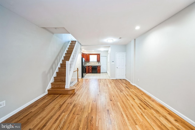 unfurnished living room with light hardwood / wood-style flooring