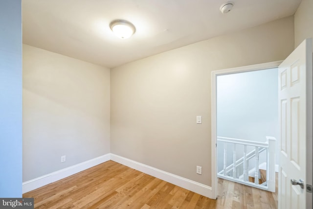 empty room with light hardwood / wood-style floors