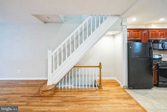 stairway featuring hardwood / wood-style flooring