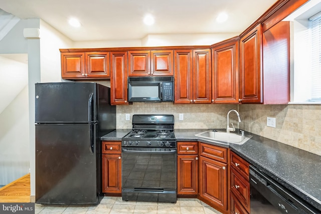 kitchen featuring sink, backsplash, and black appliances