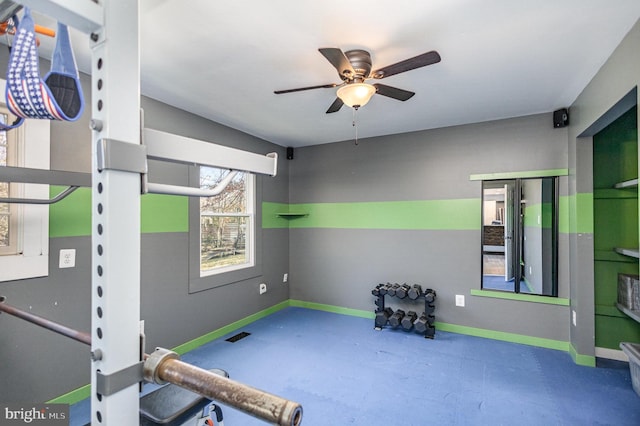 workout room featuring ceiling fan