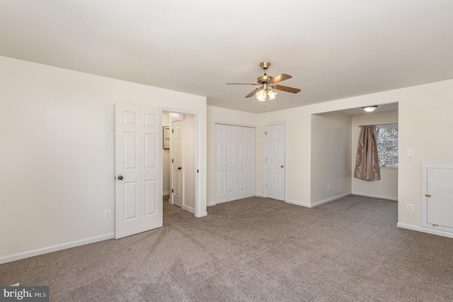 unfurnished room with light carpet and ceiling fan