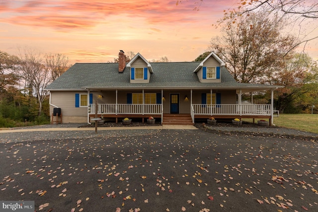 farmhouse inspired home with a porch