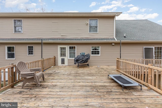 rear view of property with a deck