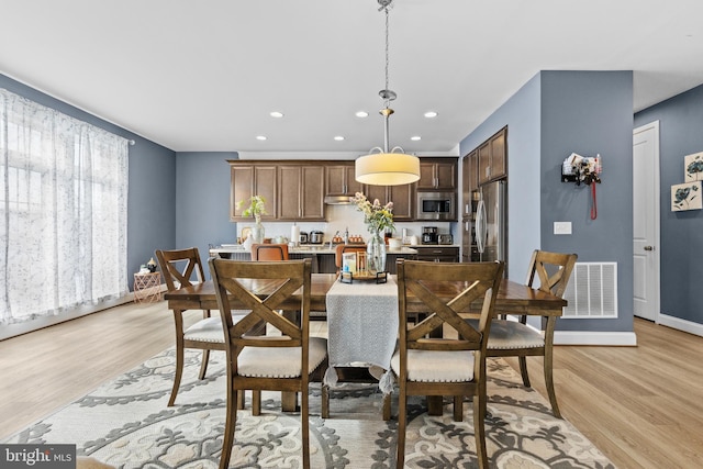 dining area featuring light hardwood / wood-style flooring