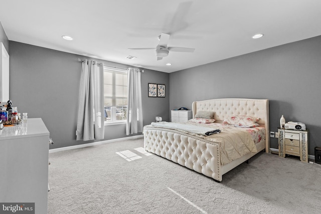 bedroom featuring light colored carpet and ceiling fan