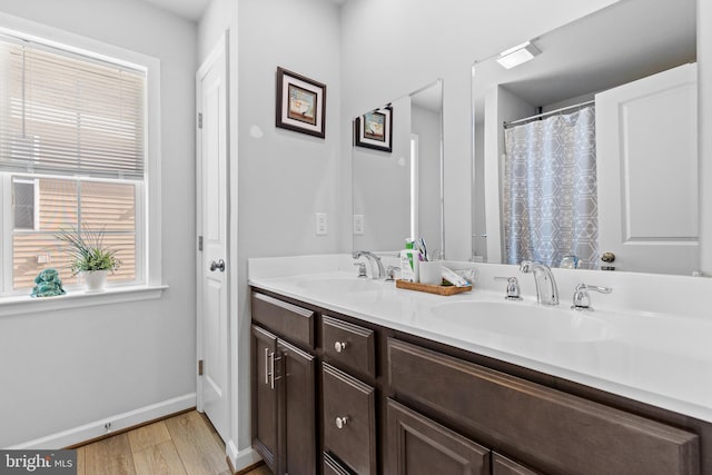 bathroom featuring vanity and hardwood / wood-style flooring