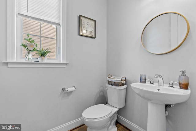 bathroom featuring sink and toilet