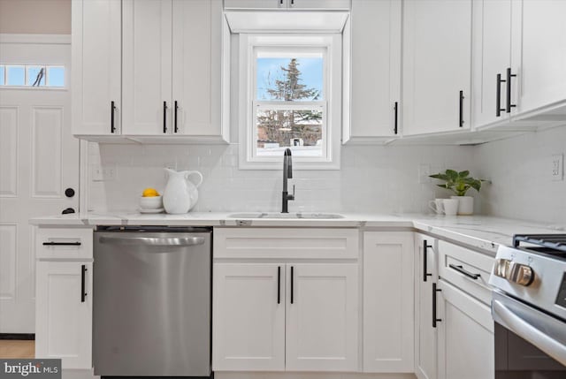 kitchen featuring sink, white cabinetry, and appliances with stainless steel finishes