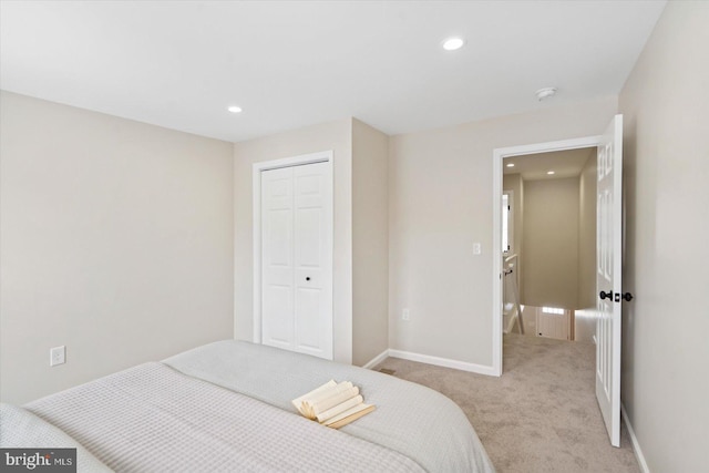 carpeted bedroom featuring a closet