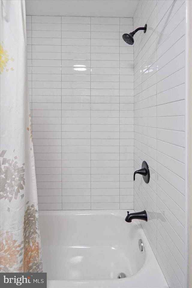 bathroom featuring shower / bath combination with curtain