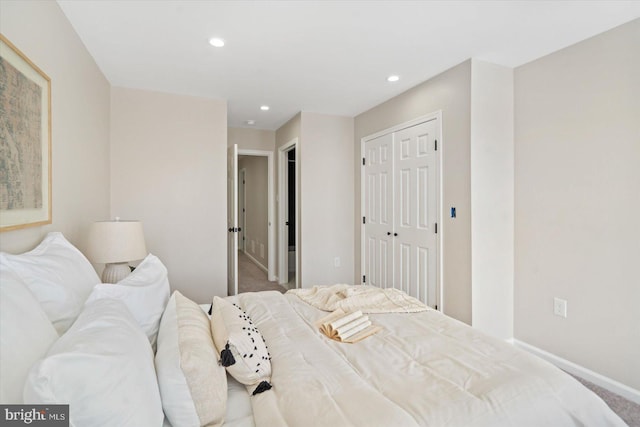 bedroom with a closet and carpet flooring