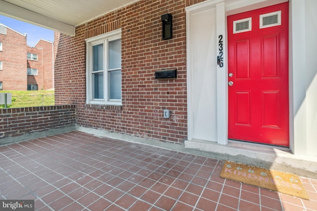 property entrance featuring covered porch