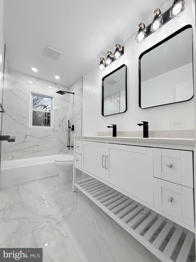 full bathroom featuring vanity, toilet, and tiled shower / bath combo